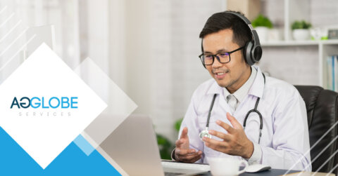 doctor wearing headphones in meeting on laptop