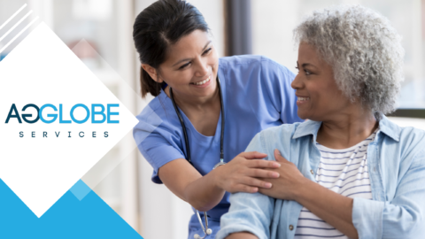 Nurse looking at an old woman patient while smiling at each other