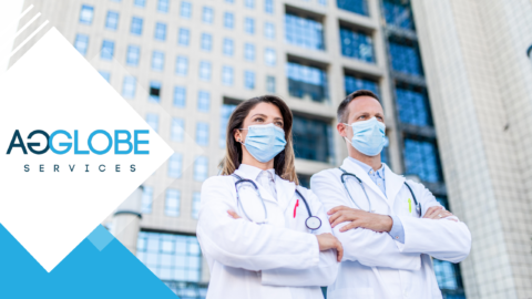 two healthcare workers standing behind a hospital indicating environmental responsibility